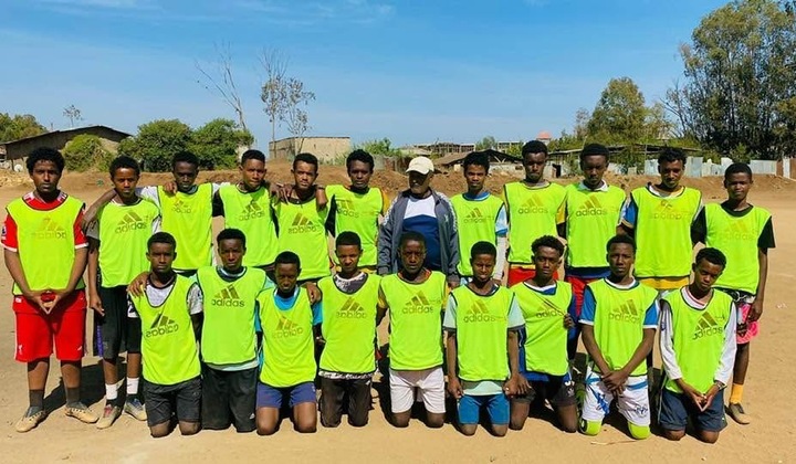 Haramaya players lined up in bright green training bibs